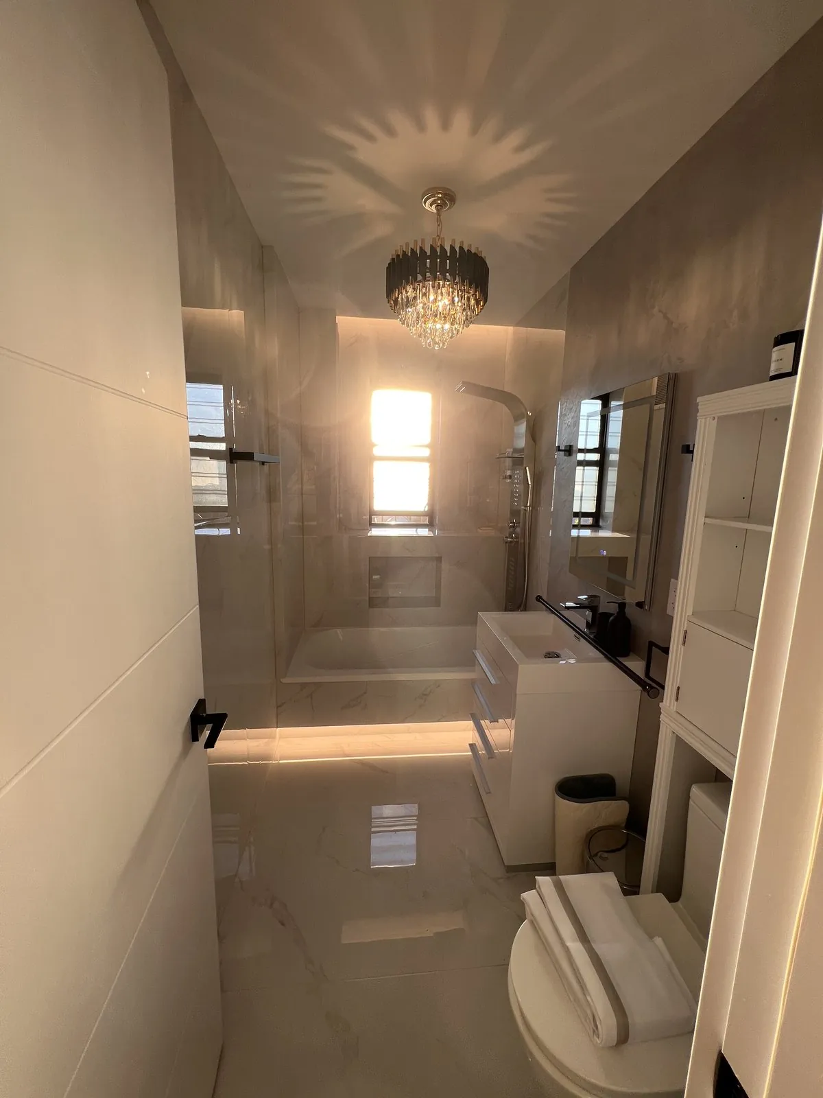 New tub and glass shower under the window