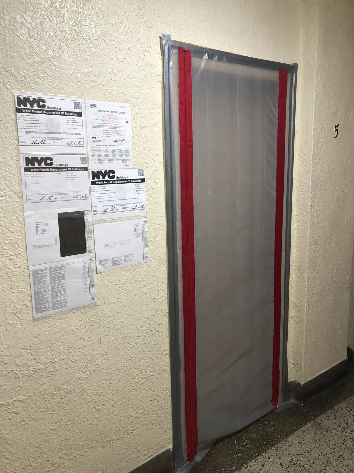 DOB work permit posted on the door