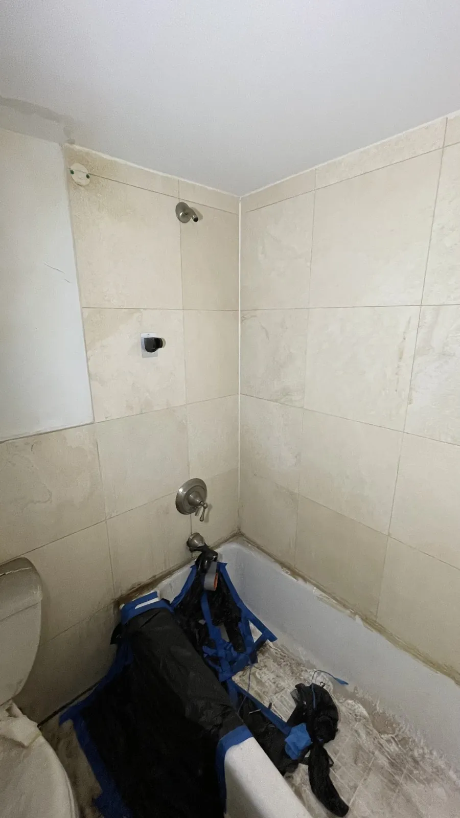 Original beige-tile tub surround