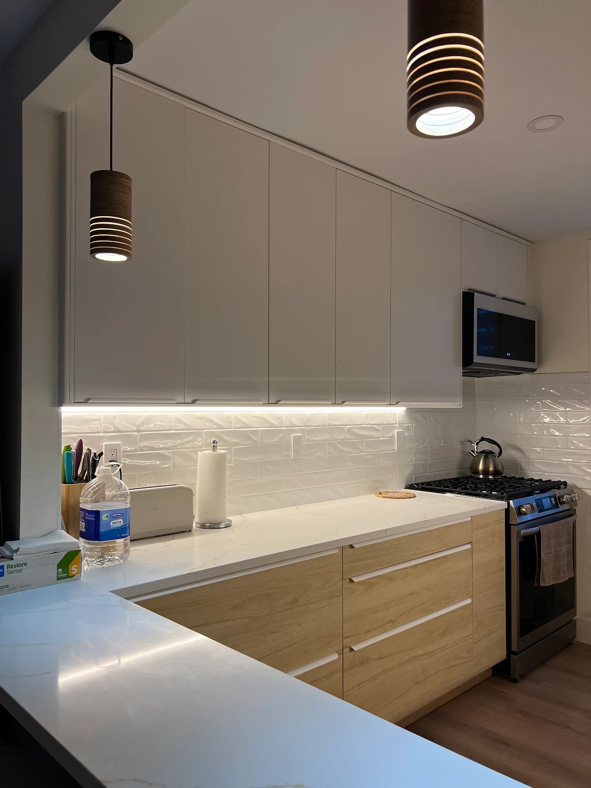 Co-op kitchen rebuild — marble counter, pendant lights